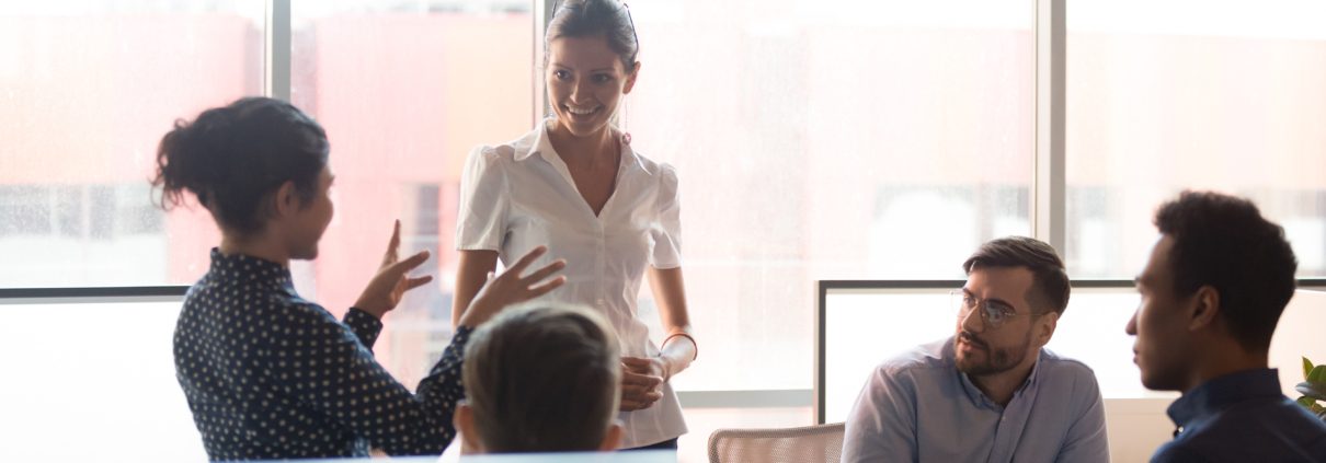 diverse group sit for training and cross training meeting